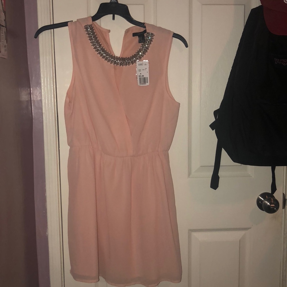 Cute peach dress brand new with tags!